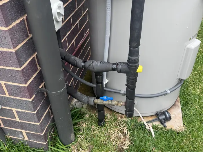Electric storage hot water system installed with insulated pipework and isolation valves