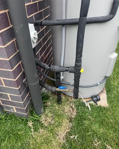 Electric storage hot water system installed with insulated pipework and isolation valves