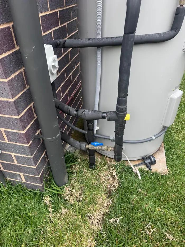 Electric storage hot water system installed with insulated pipework and isolation valves