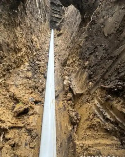 Conduit laid in a deep, clean-cut trench
