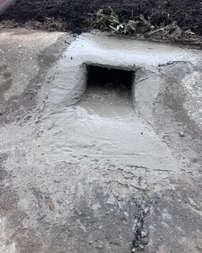 Stormwater kerb outlet cast into the gutter