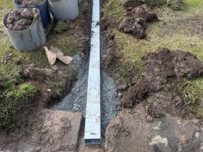 Stormwater upgraded to galvanised steel pipe running to the kerb, laid on gravel bedding